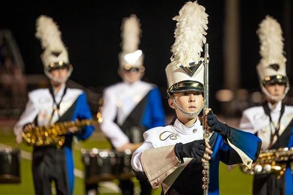 Brentwood High band members play on the football field